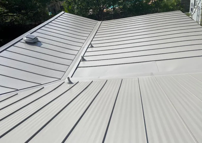 Solar attic fan installed on a metal roof for Roof Ventilation in East Foothills